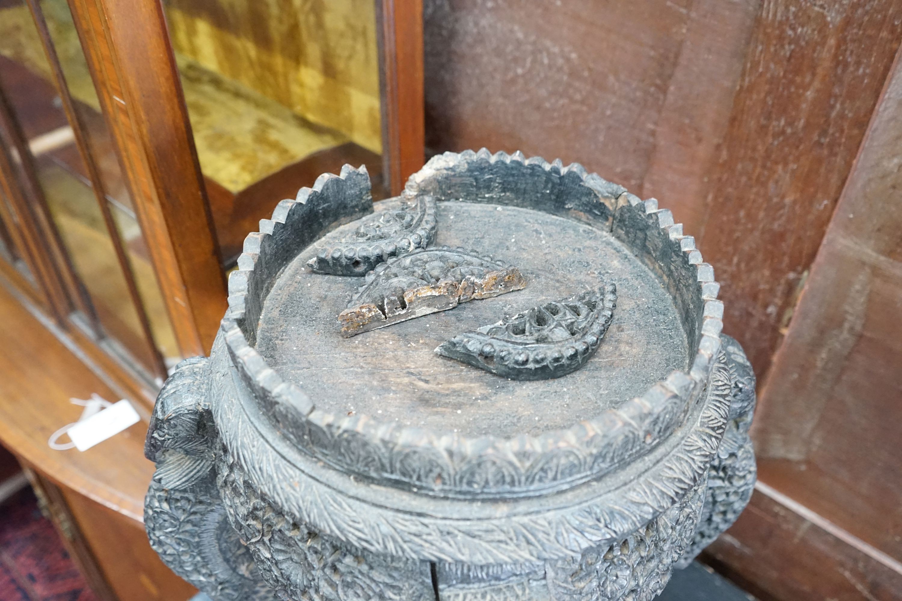 A Burmese carved hardwood jardiniere stand, width 32cm, height 49cm